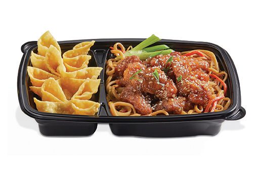 Food service tray with pasta and wontons ready to eat